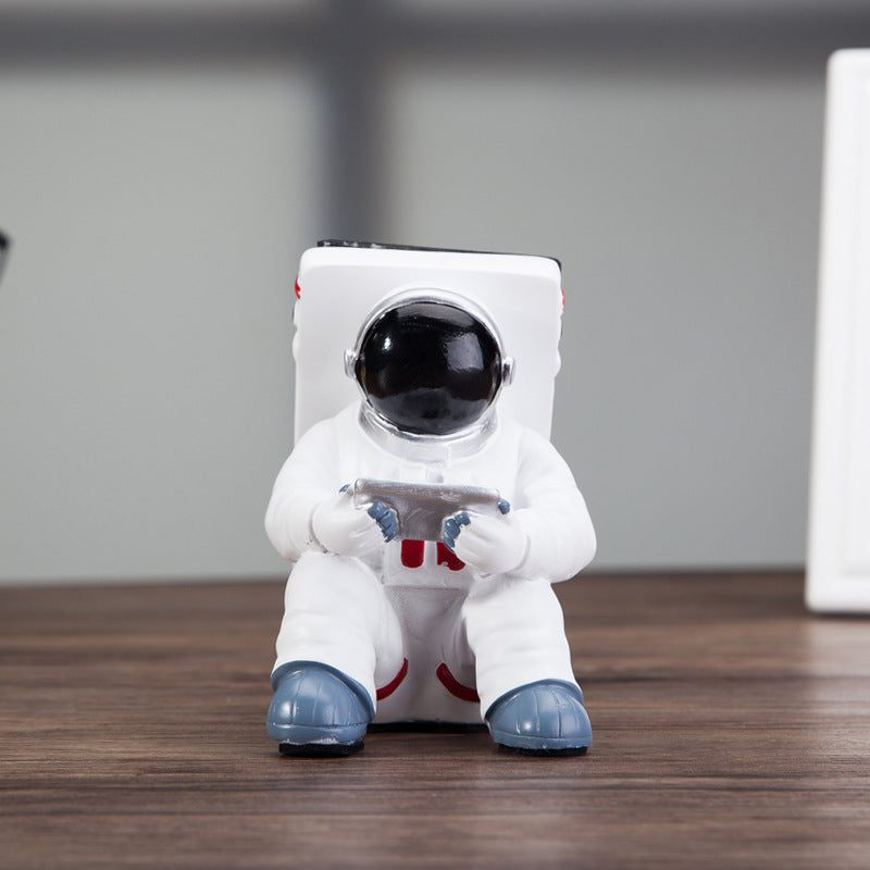 Space Spaceman Mobile Phone Desk Holder with a phone for a minimalist workspace design