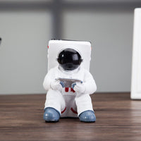 Space Spaceman Mobile Phone Desk Holder with a phone for a minimalist workspace design