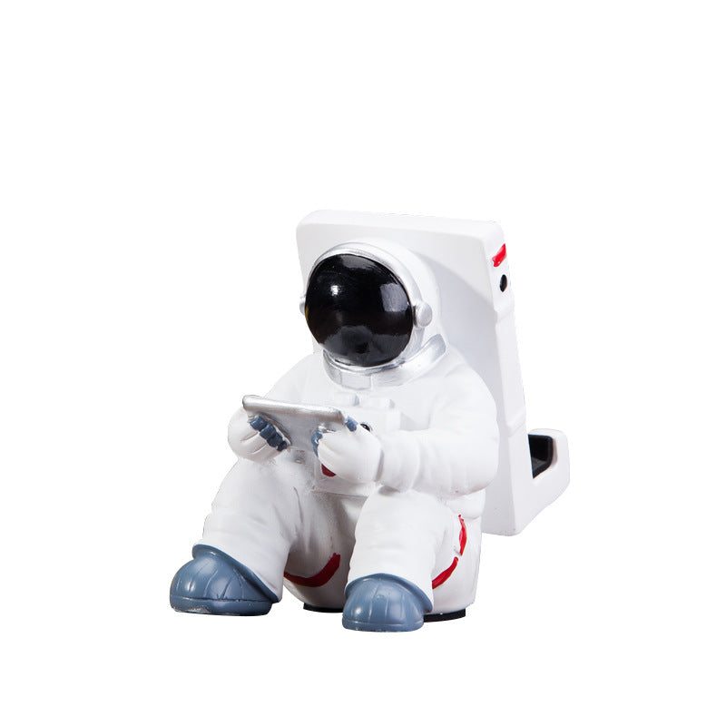 Close-up of Space Spaceman Mobile Phone Desk Holder for compact workspace organization