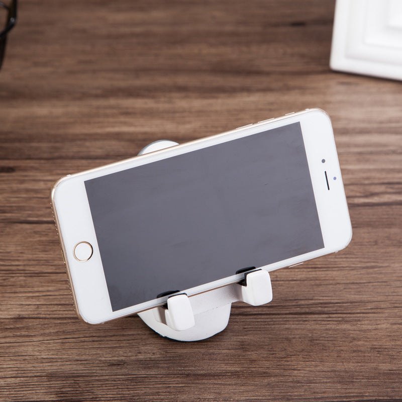 Lifestyle shot of Space Spaceman Mobile Phone Desk Holder in a modern home office setup